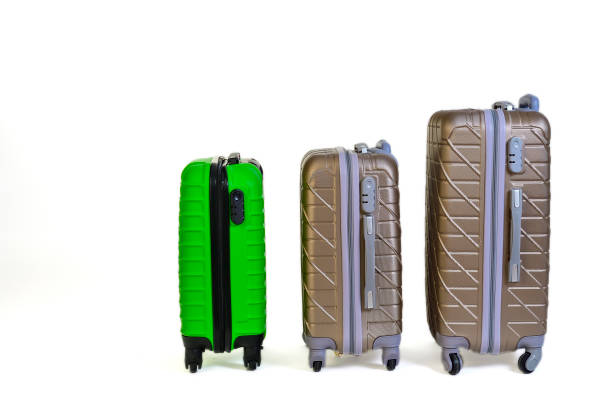 istock Elegant suitcases on a color background. 1345865549