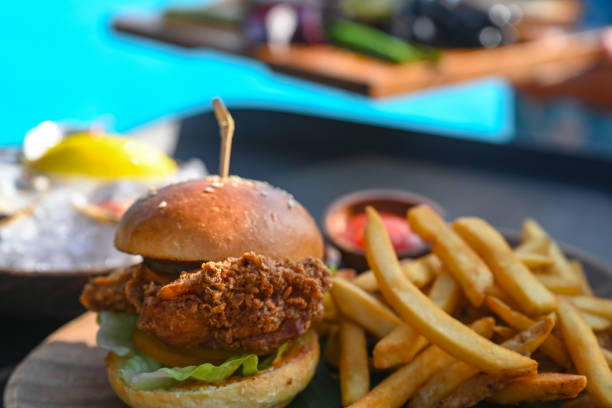 istock Serving burger and french fries 1345867652