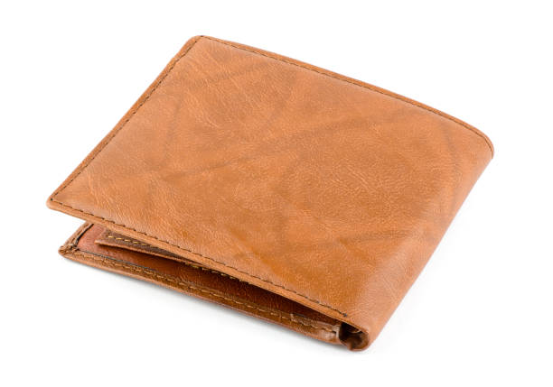 istock Closed brown male wallet on a white background close-up, isolate 1345869143