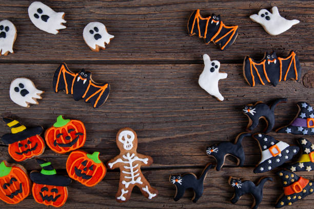istock Halloween homemade gingerbread cookies on rustic wooden table 1345872327