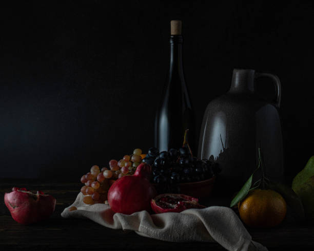 istock Still life with wine and fruits 1345877937