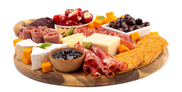 charcuterie board auf weißem hintergrund isoliert - brettchen stock-fotos und bilder