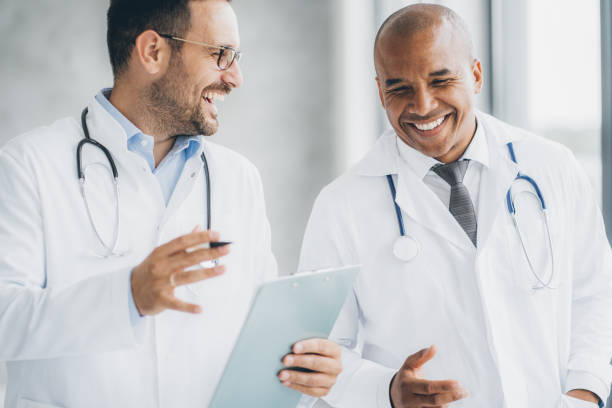istock Two doctors talking at hospital 1345882878