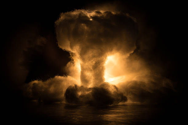 istock Nuclear war concept. Explosion of nuclear bomb. Creative artwork decoration in dark. 1345887013