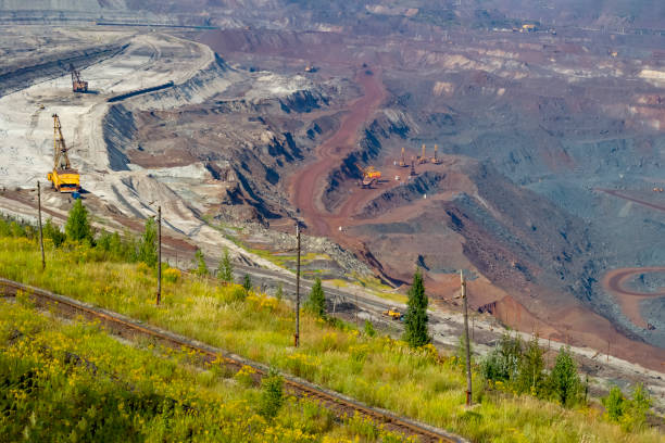 istock Concept of mineral development - panorama of operating ore mine. 1345887755