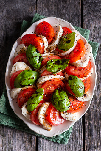 Classic Caprese Salad with Tomato, Mozzarella, Basil, Olive Oil and Balsamic Vinegar Glaze