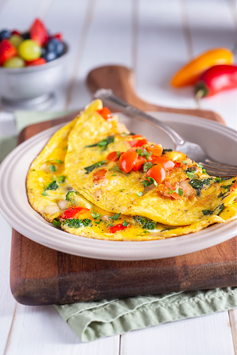 Healthy breakfast food, Stuffed egg omelette with vegetable on white background