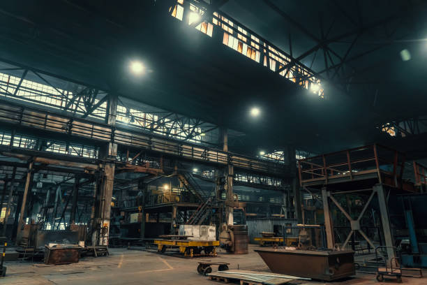 istock Large metallurgical factory workshop interior and machines 1345888868