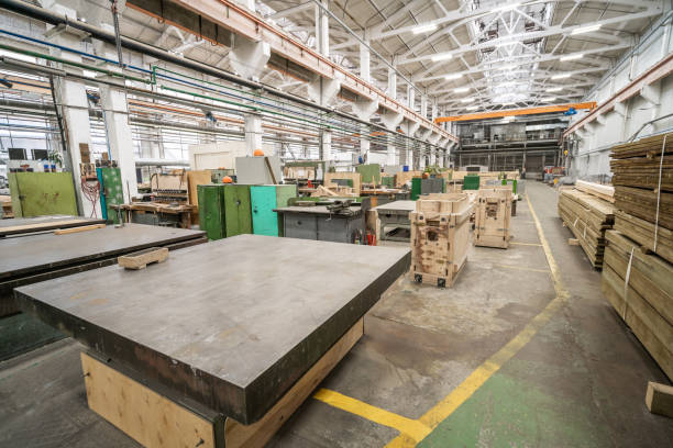 istock Inside interior factory workshop with stacks of wood for making molds and carpentry machine tools 1345892741