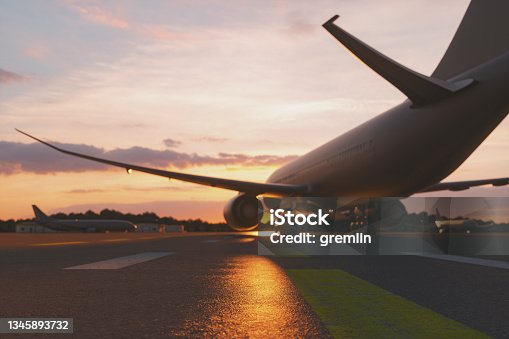 istock Empty airport at sunset 1345893732