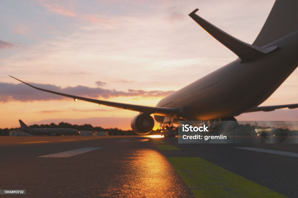 Empty airport at sunset Empty airport at sunset, 3D generated image, generic location. Airplane Stock Photo