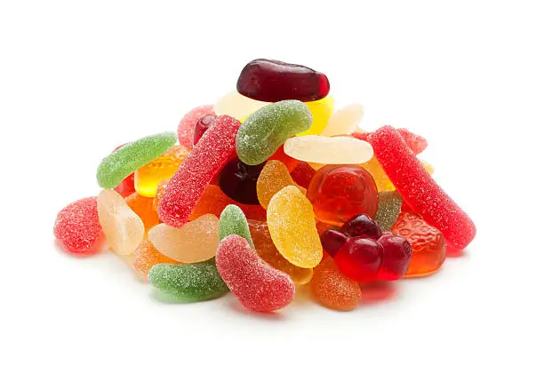 heap of jelly beans and wine gums isolkated on white