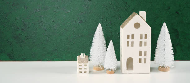 istock Christmas framed border backdrop background with white village houses. 1345902001