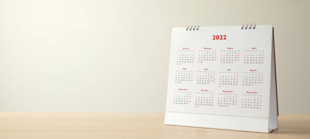 Close up 2022 calendar page dates and month background business planning appointment meeting concept stock photo