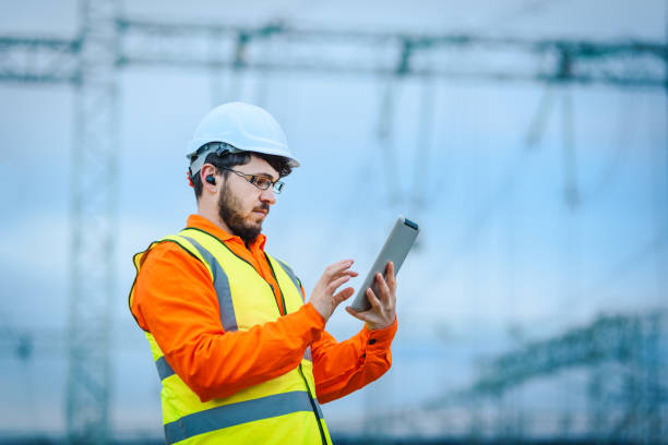 istock Electrical engineer working in front of Electricity power station 1345903042