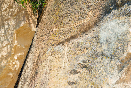 Ancient rock painting petroglyphs on rocks in Gobustan park, Azerbaijan