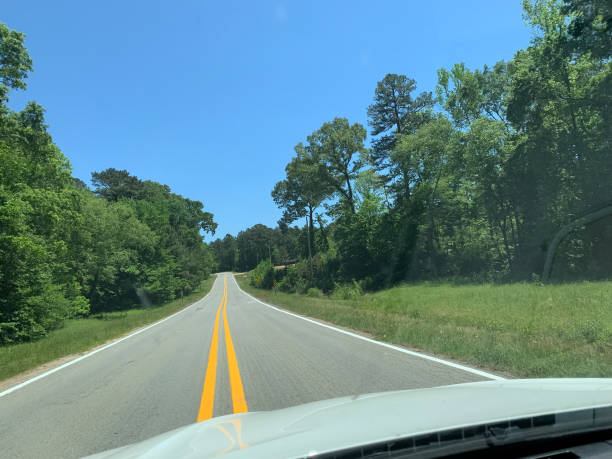 istock road in rural Arkansas in summer 1345907318
