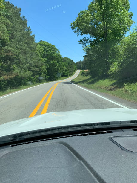 istock road in rural Arkansas in summer 1345907379