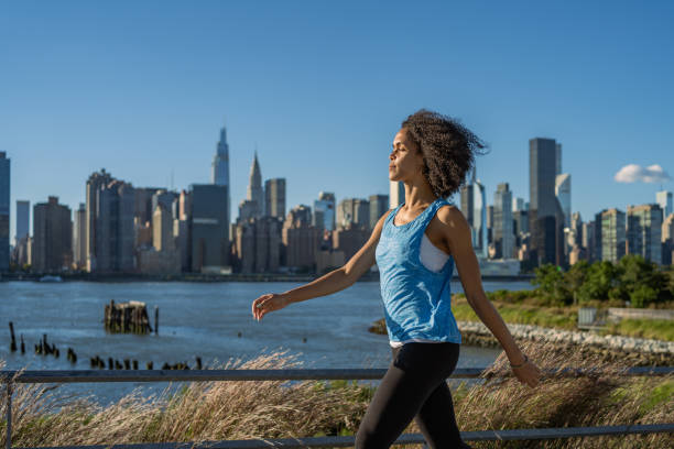 Beautiful black woman exercising outdoors in New York City stock photo
