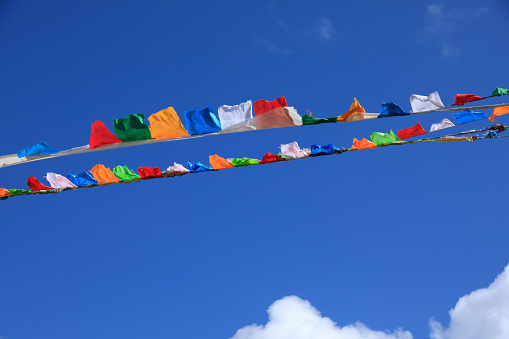 Tibetan prayer flags background blue sky
