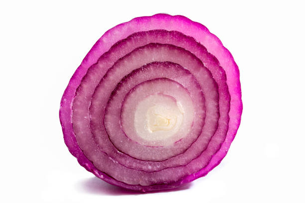 istock Violet onion in a cut on a white background close-up. 1345921499
