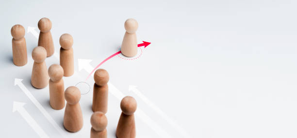 istock The wooden figure standing on red arrow, change direction. 1345922627