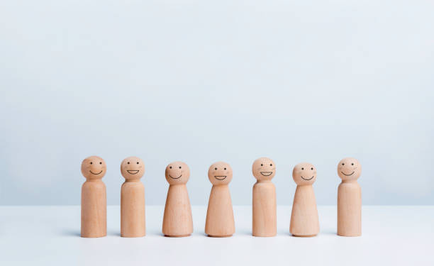 istock People community concept. Group of wooden figures. 1345922690