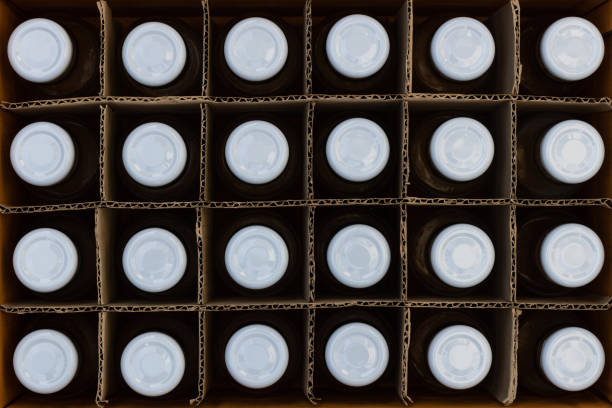 istock glass bottles in a cardboard box with partitions for transporting broken items. 1345927338