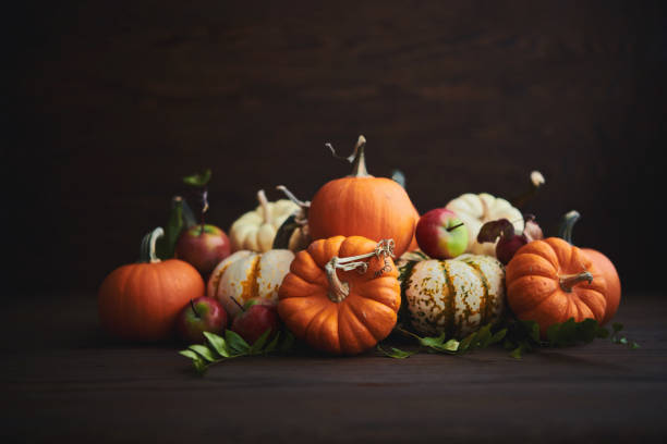 istock Rustic Fall Arrangement for Thanksgiving with Pumpkins and Crabapples 1345933089