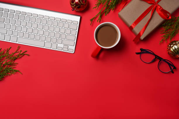 istock Top view Christmas gift boxes and coffee cup on red background. 1345933099