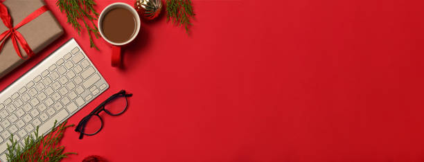 istock Above view coffee cup, glasses and Christmas gift box on red background. 1345933101