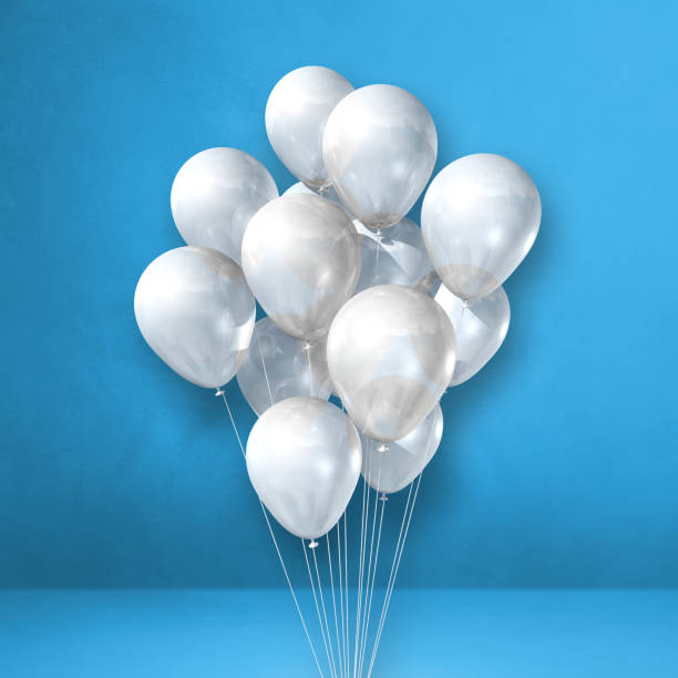 istock White balloons bunch on a blue wall background 1345933497