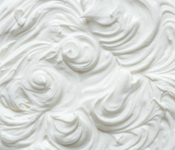 istock Creamy pics in yoghurt or cream surface. Top view. 1345936727