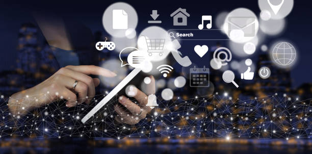 istock Communication and network concept. Hand touch white tablet with digital hologram social media icons sign on city dark blurred background. Digital online concept. 1345936821