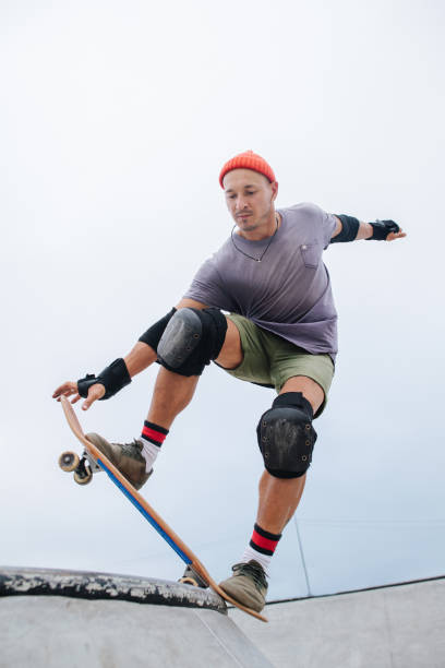 istock Confident mature skater in a watch cap starting his roll 1345938554