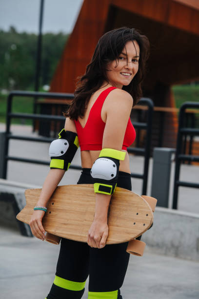 istock Happy confident brunette skater looking at the camera, turning her head. 1345938573
