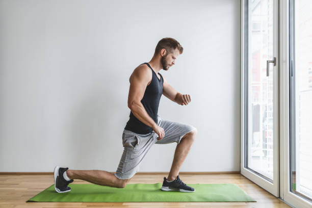 istock Handsome man working out at home 1345938731