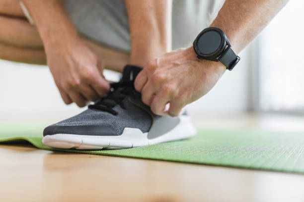 istock Handsome man working out at home 1345938814