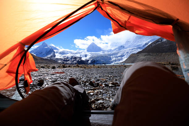 istock Hiker enjoy the beautiful landscape in tent 1345940006