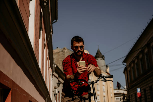 istock Hipster man using a app for city traveling 1345941340