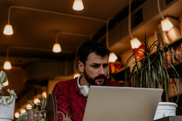 istock Focused and confused freelancer, working outdoors 1345942167