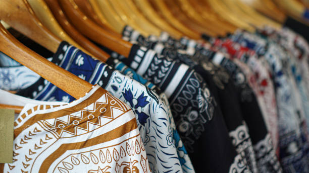 istock Clothes hang on a shelf in a designer clothes store 1345942477