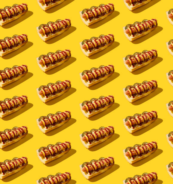 istock Seamless pattern with sandwiches on a yellow background. American junk food pattern concept. 1345944243