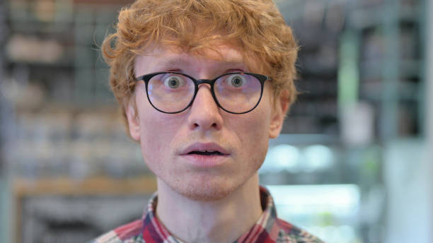 istock Close Up, Redhead Young Man Feeling Shocked, Surprised 1345944279