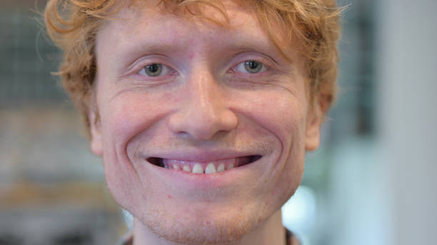 istock Close Up, Face Redhead Young Man Smiling at the Camera 1345944301