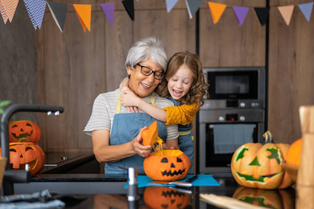 istock family preparing for Halloween 1345945452