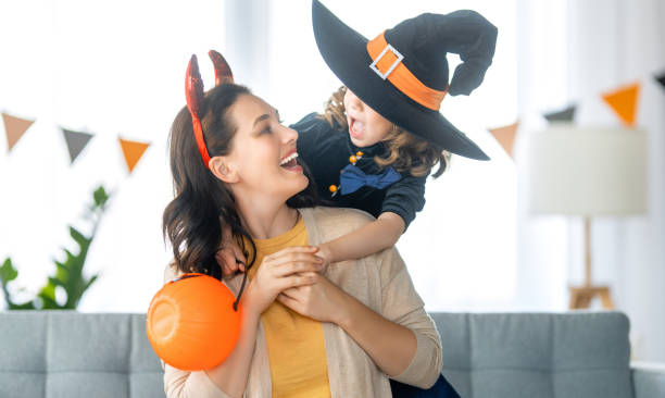 istock Happy family celebrating Halloween 1345946993