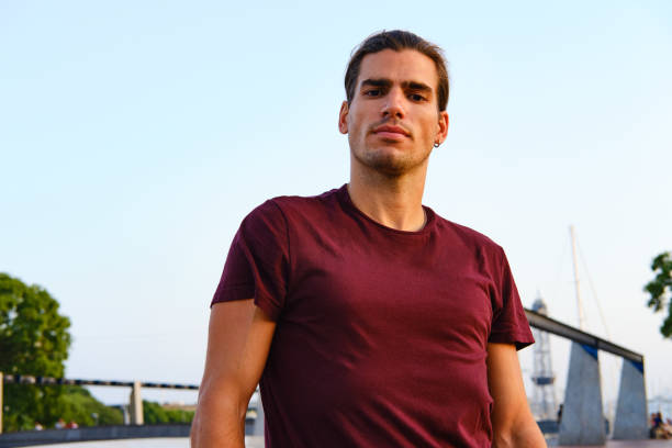 istock Young man looking at the camera outdoors. 1345947269
