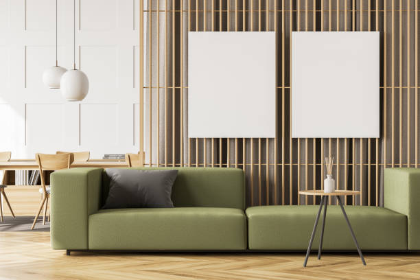 istock White and green living room with two canvas and tables 1345947300