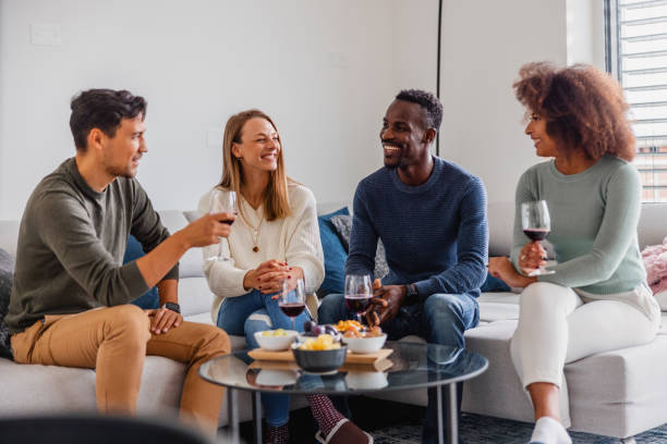 istock People enjoying drinking wine together 1345947588